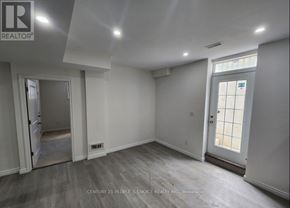 Waterloo apartment for rent - A room with a door and a window, with a logo on the wall.