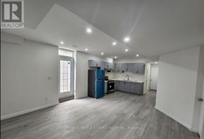Waterloo apartment for rent - A spacious room with a kitchen area and a large window.