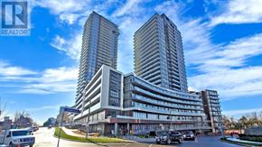 Toronto (Henry Farm) condo for rent - A large building with a sign that says "REALTOR" in front of it.