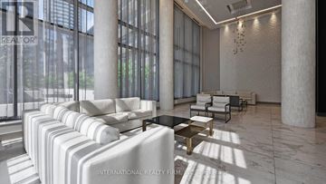 Toronto (Henry Farm) condo for rent - A modern living room with white furniture and large windows.