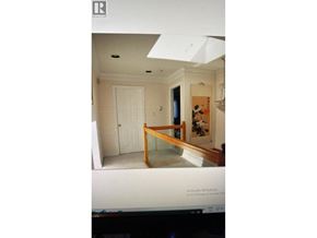 Vancouver apartment for rent - A computer screen shows a room with a door and a painting on the wall.