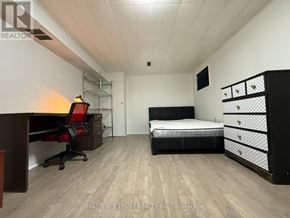 Toronto (Tam O'shanter-Sullivan) apartment for rent - A bedroom with a bed, desk, and drawers.