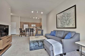 St. Paul apartment for rent - A living room with a grey couch and a coffee table.