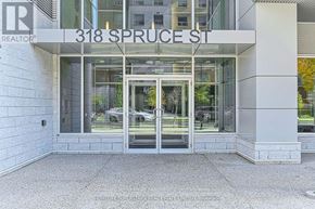 Waterloo condo for rent - The entrance to a building with a glass door and a sign that reads "318 Spruce St."
