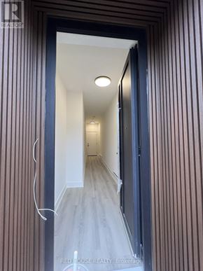 St. Catharines (Oakdale) townhouse for rent - A hallway with a light on the ceiling and a door on the right.