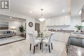 Hamilton (Westcliffe) apartment for rent - A modern kitchen with a glass table and chairs.