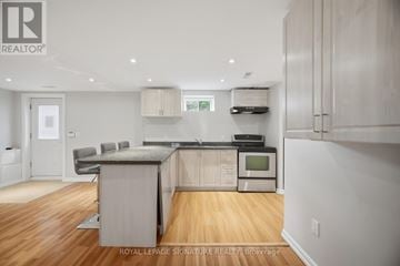 Vaughan (East Woodbridge) apartment for rent - A kitchen with wooden floors and white walls.
