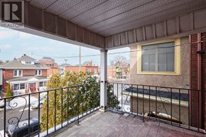 Ottawa duplex for rent - A balcony with a metal railing and a view of the street below.