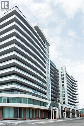 Hamilton condo for rent - A tall building with a lot of windows and balconies.