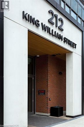 Hamilton condo for rent - The entrance to a building with a sign that reads "King William Street.".