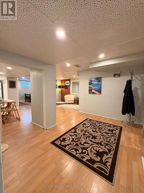 Toronto (Newtonbrook West) apartment for rent - A room with a brown rug and wooden floors.
