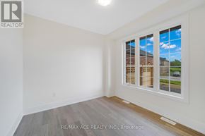 Otonabee-South Monaghan apartment for rent - A room with a large window showing a view of a house and trees outside.