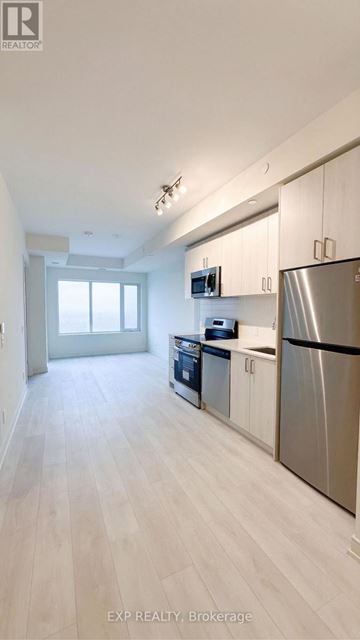 Milton (Co Coates) condo for rent - A kitchen with white cabinets and stainless steel appliances.