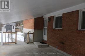 London North (North K) apartment for rent - A brick house with a white door and a window.