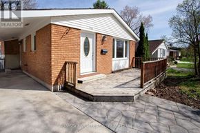 London North (North K) apartment for rent - A red brick house with a white roof and a tree in front.