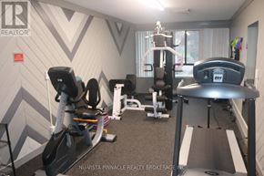 London North (North C) condo for rent - A gym room with a treadmill, elliptical trainer and other exercise equipment.
