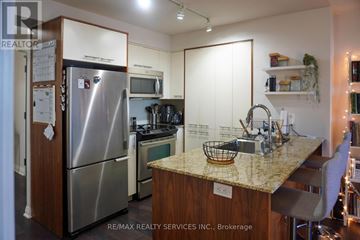 Toronto (Islington-City Centre West) condo for rent - A kitchen with a refrigerator, microwave, oven, and sink.