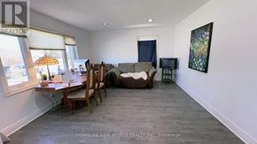 Toronto (Wexford-Maryvale) apartment for rent - A kitchen with wooden cabinets and a white refrigerator.