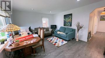 Toronto (Wexford-Maryvale) apartment for rent - A kitchen with wooden cabinets and a white refrigerator.