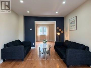 Mississauga (Rathwood) apartment for rent - A living room with a glass table and two couches.