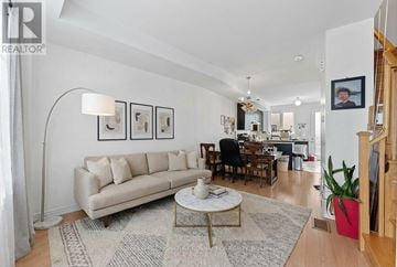 Toronto (Willowridge-Martingrove-Richview) townhouse for rent - A living room with a white couch and a coffee table.