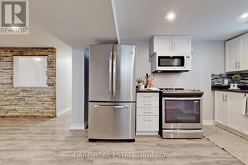 Hamilton (Raleigh) apartment for rent - A modern kitchen with a stainless steel refrigerator and oven.