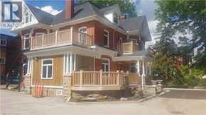 Grimsby apartment for rent - A house with a balcony and a sign that says REALTOR.