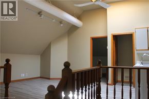 Grimsby apartment for rent - A room with a ceiling fan and a wooden staircase.