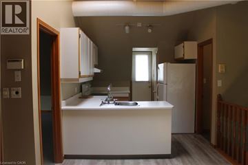 Grimsby apartment for rent - A kitchen with a sink and a refrigerator.