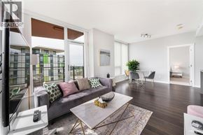 Vancouver apartment for rent - A living room with a grey couch and a coffee table.