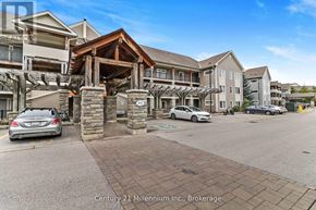 Collingwood condo for rent - A car is parked in front of a building with a stone pillar and a sign that says Century 21 Millennium Inc., Brokerage.