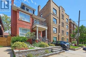 Toronto (Oakwood Village) fourplex for rent - A building with a sign that says RE/MAX West Realty Inc. Brokerage.