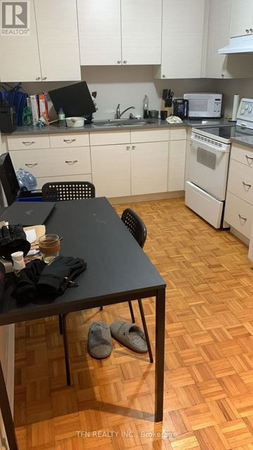 Toronto (Oakwood Village) apartment for rent - A kitchen with a table and chairs in it.