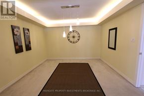 Vaughan (Crestwood-Springfarm-Yorkhill) townhouse for rent - A hallway with a rug on the floor and pictures on the wall.
