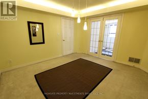 Vaughan (Crestwood-Springfarm-Yorkhill) townhouse for rent - A room with a brown rug in the center and a picture frame on the wall.