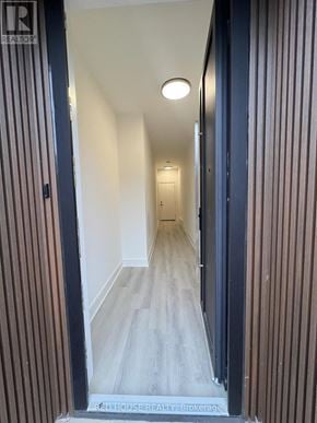 St. Catharines (Oakdale) townhouse for rent - A hallway with a wooden floor and striped walls.