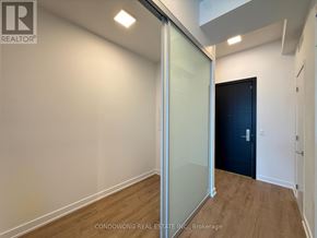 Toronto (Bayview Village) condo for rent - A room with a glass door and a black door.