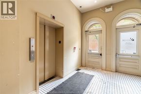Chatham apartment for rent - A hallway with a tiled floor and a door on the left.