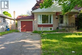 Richmond Hill (Crosby) apartment for rent - A house with a red garage door is for sale.