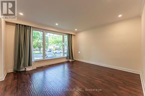 Richmond Hill (Crosby) apartment for rent - A room with a window and a wooden floor.