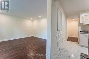 Richmond Hill (Crosby) apartment for rent - A real estate listing photo of a kitchen and living room.