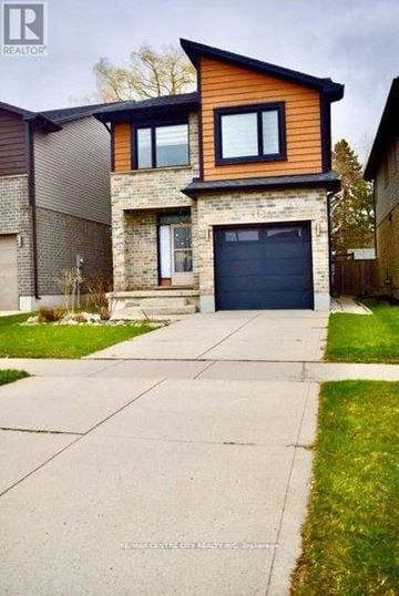 London North (North E) apartment for rent - A modern house with a garage door is for sale.