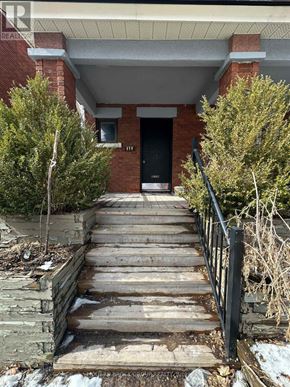 Ottawa triplex for rent - A set of stairs leading to a black door.