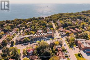 Toronto (Birchcliffe-Cliffside) townhouse for rent - A bird's eye view of a residential area with a sign that reads "Keller Williams Portfolio Realty".