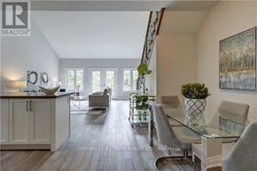 Barrie (Ardagh) apartment for rent - A modern living room with a glass table and grey chairs.