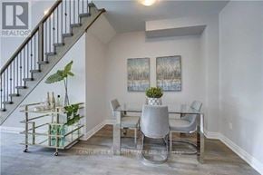 Barrie (Ardagh) apartment for rent - A living room with a glass coffee table and a grey chair.
