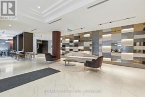 Kitchener condo for rent - A modern living room with a marble floor and a large mirror on the wall.