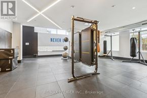Kitchener condo for rent - A gym with a squat rack, punching bag and a ball.