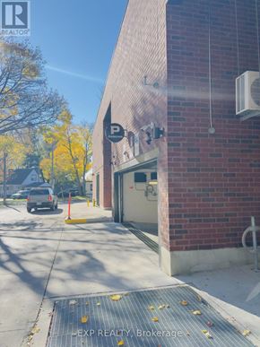 Toronto (Cliffcrest) condo for rent - A parking sign on a brick building.