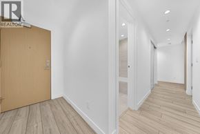 Burnaby apartment for rent - A hallway with a wooden floor and white walls.